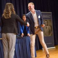 Emily shaking hands with Brady